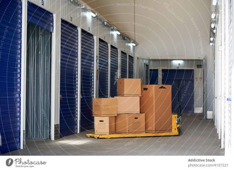 Self storage doors inside building padlock safety security box locker compartment cubicle blue protection rental warehouse business industrial unit store