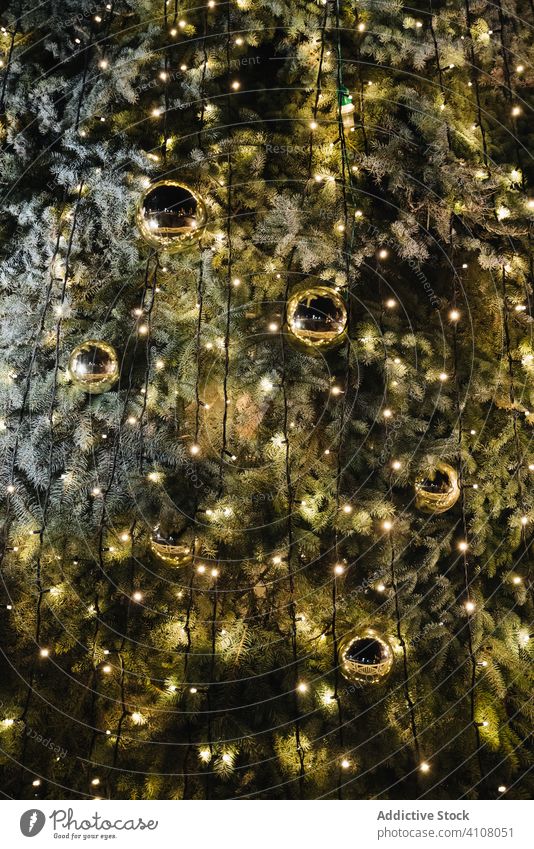 Christmas tree with balls and lights christmas decoration tradition festive shiny season winter december illuminate glow celebrate design golden style texture