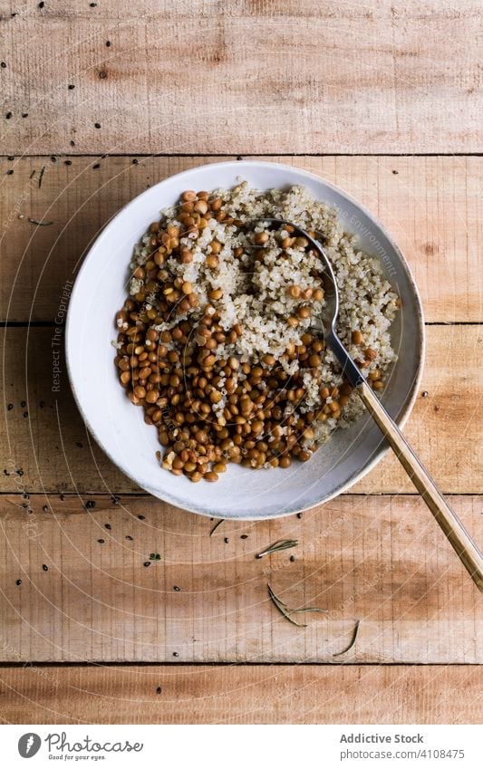 Tasty rice with beans in bowl on table mixed spoon rustic delicious food meal tasty healthy dish cuisine ingredient dinner lunch fresh nutrition cooked gourmet