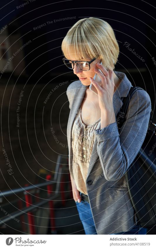 Blonde businesswoman talking on smartphone stylish young mobile connection communication conversation female professional person beautiful attractive