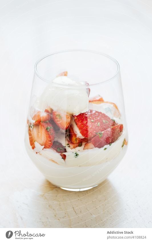 Tasty high cuisine dessert with ice cream and strawberry sweet glass food season cold snack organic gourmet table fresh tasty delicious portion natural colorful