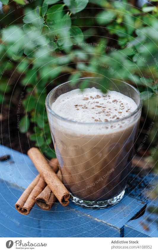 Sweet chilled eggnog drink with cinnamon beverage glass rustic delicious fresh tasty cup sweet organic punch cream ingredient milk sugar whipped liquid alcohol