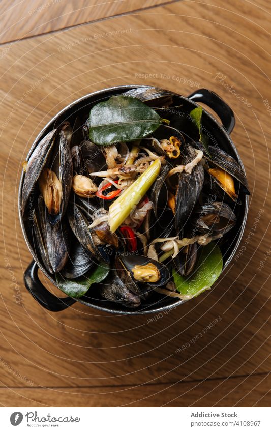 Black shellfish with vegetables in bowl delicious seafood mollusk delicacy clam celery mediterranean mussel green black marine culinary meal organic ingredient