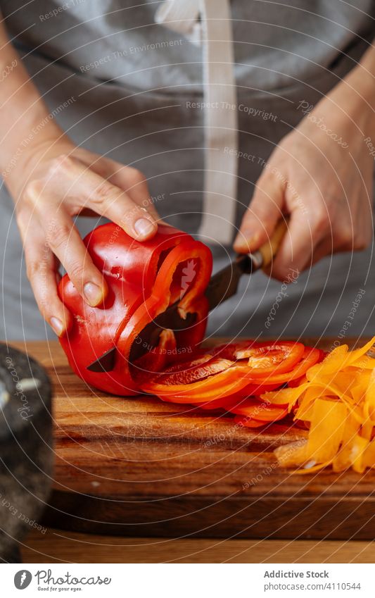Crop person slicing pepper for salad cut cook kitchen dish food preparation home knife cutting board meal ingredient culinary cuisine organic natural recipe