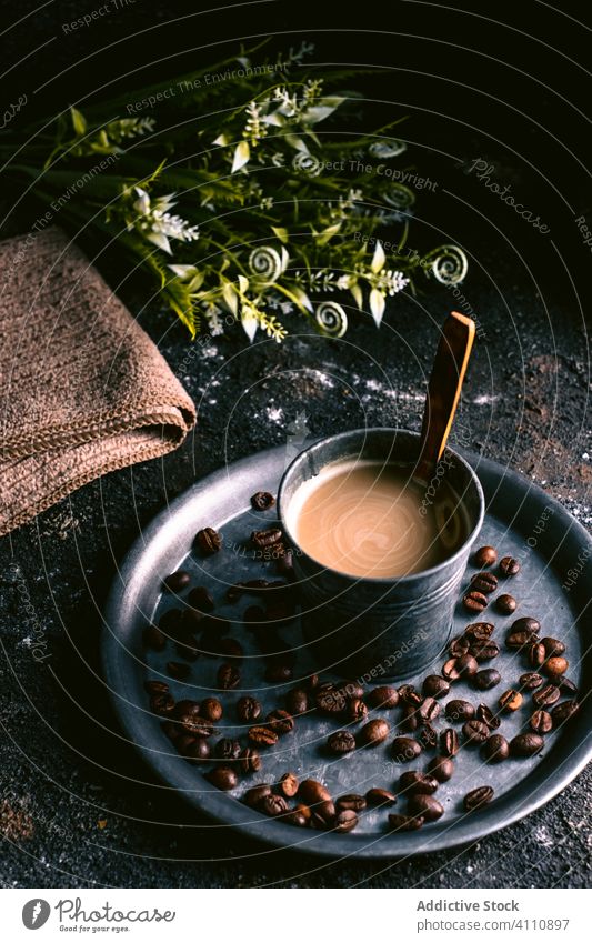 Coffee and coffee grains on tray rustic brew fresh spoon cup beverage breakfast caffeine drink delicious aroma rough tasty natural table liquid energy morning
