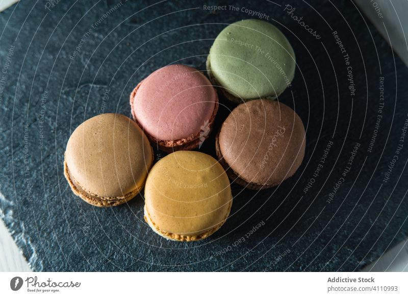 Fresh crunchy macaroons on table macarons dessert colorful snack food wall biscuit sweet gourmet assorted pastry confection traditional delicious tasty yummy