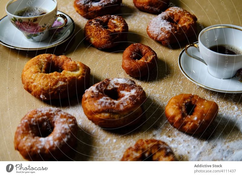 Sweet donuts and tea on table sweet sugar home cup saucer food delicious dessert pastry tasty fresh breakfast snack gourmet drink beverage doughnut morning