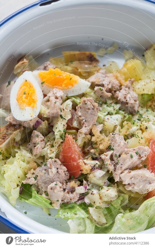 Tuna salad with vegetables and egg restaurant tuna meal food fresh portion fish tasty delicious healthy dish cuisine gourmet dinner natural lunch cafe cafeteria