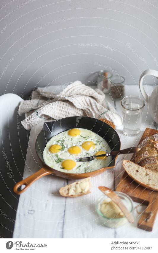 Simple breakfast with fried eggs and bread fry rustic simple homemade pan food table wooden meal kitchen fresh tasty cuisine cook dish ingredient tradition