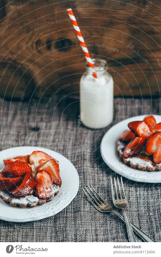 Homemade dessert with strawberry on table sweet homemade pastry breakfast milk waffle food tasty fresh delicious plate meal nutrition yummy serve dish wooden