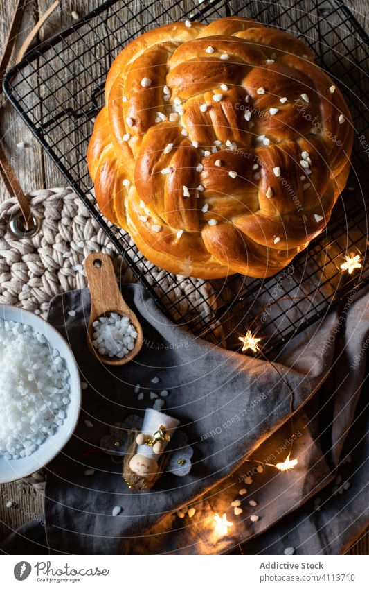 Homemade festive bread on table with Christmas decoration christmas food fresh braided tradition meal celebrate winter appetizing napkin cook crust crunch