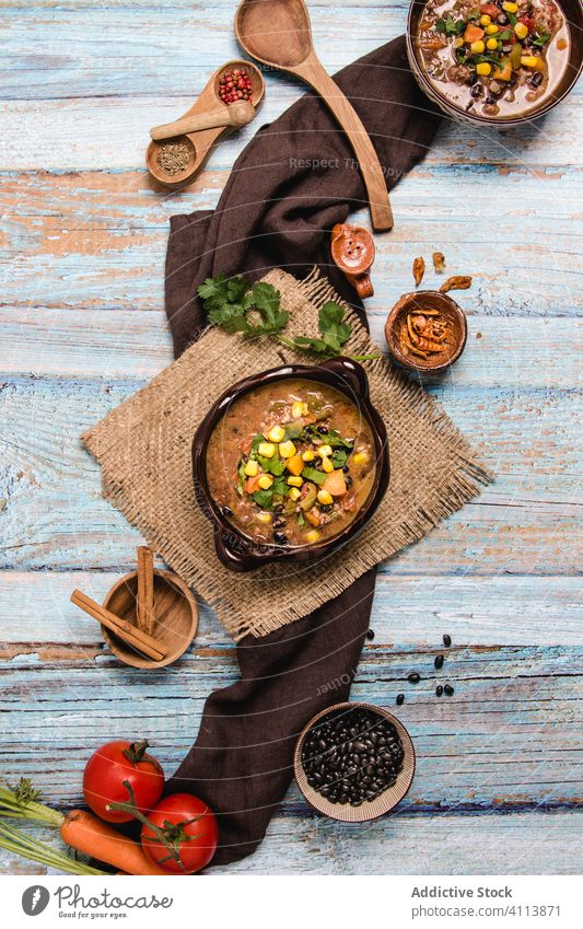 Traditional Mexican dish chili with meat food mexican tradition pepper hot spice delicious meal bowl pan table wooden cook cuisine ingredient gourmet rustic