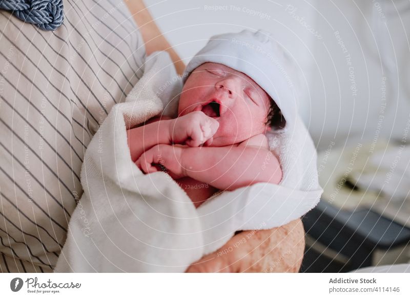 Woman visiting daughter with newborn baby in hospital grandmother care greeting clinic neonatal kid medicine multi generational together love relationship