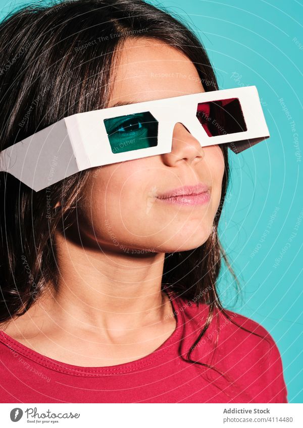 Pensive pleased girl in 3d glasses cinema kid brunette preteen stereoscopic woman happy spectacles childhood female illusion dimensional optical entertain