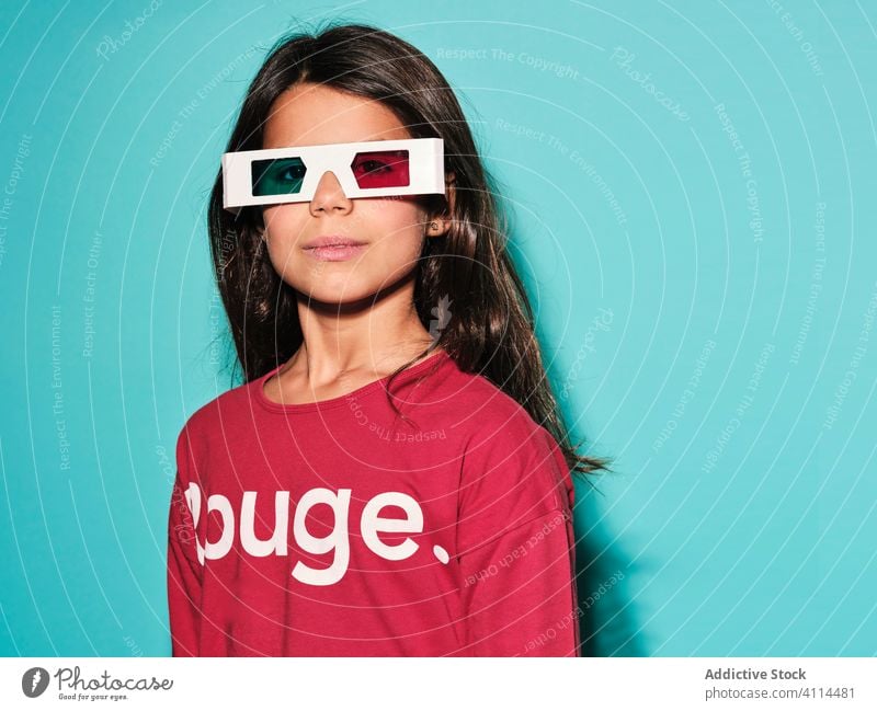 Pensive pleased girl in 3d glasses cinema kid brunette preteen stereoscopic woman happy spectacles childhood female illusion dimensional optical entertain