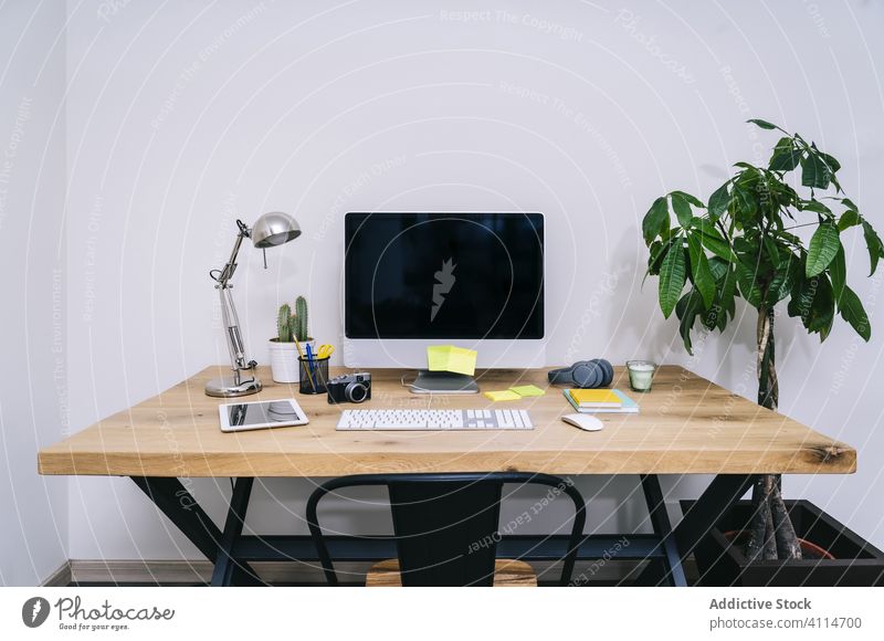 Modern creative home workspace with computer design modern table office desk white lamp desktop book interior screen background monitor business technology room
