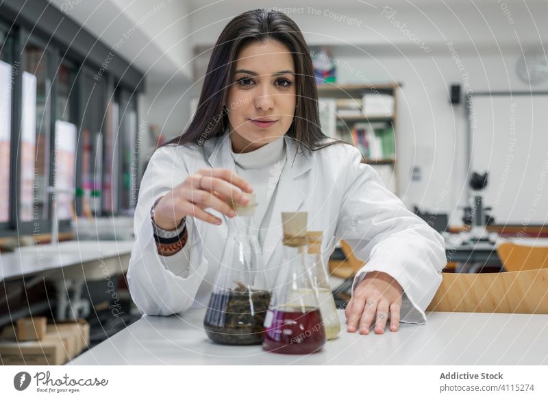Young scientist in contemporary lab woman laboratory chemistry student university young experiment research smart female study learn education table modern