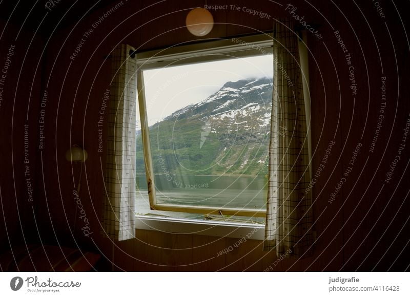 View through the window of a norwegian cabin into the nature Window Hut Lamp outlook Vantage point Norway Fjord Landscape Mountain travel Tourism Scandinavia