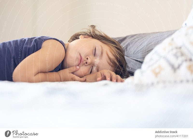 Cute baby sleeping on bed toddler bedroom home comfort cozy peaceful child rest kid relax tranquil cute asleep little nap adorable calm serene harmony innocent