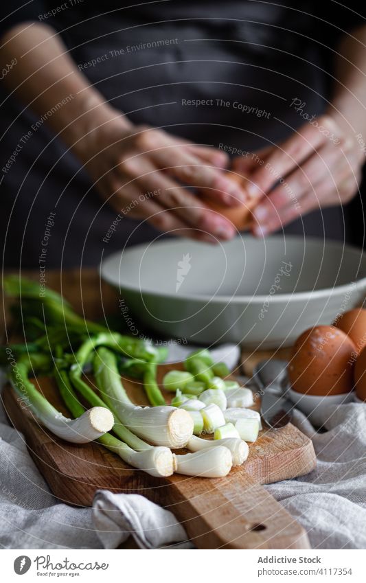 Scallions and mushrooms near cooking housewife scallion ingredient mix cutting board rustic fresh kitchen bunch food bowl whisk home onion poppy seed egg