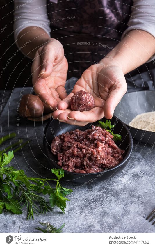 Crop person making meatballs for lunch cook kitchen minced show fresh cuisine prepare gourmet dinner food meal ingredient nutrition recipe herb parsley natural