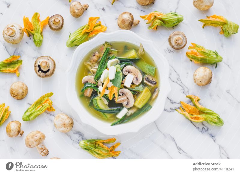 Vegetable soup with mushroom and zucchini flowers salad cucumber exotic fresh super food healthy natural cuisine dinner plant leaf composition vegetarian