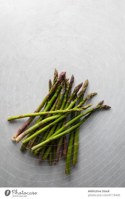 Fresh asparagus on marble table fresh green bunch healthy vegetarian food kitchen raw cook plant meal diet cuisine herb delicious colorful prepare vegetable