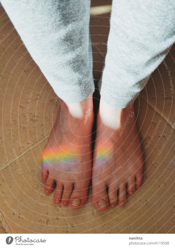 High angle view of a rainbow reflected over feet magical equality diversity prism reflection real real people point of view ligth sunligth feel feelings touch