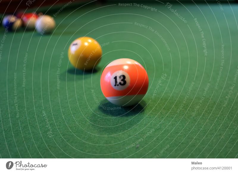 Colored pool balls on a green pool table sport snooker leisure sphere color competition game gambling group number recreational billiard play hobbies cue fun