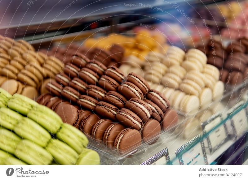 Tasty multi colored macaroons in pastry shop window patisserie confectionery colorful tasty assorted yummy sweet dessert delicious almond different various