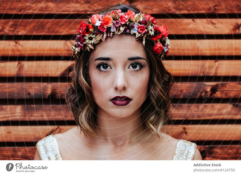 Beautiful woman in wreath against wooden wall makeup style beauty flower fashion elegant female model bride glamour vogue pretty young attractive trendy lumber