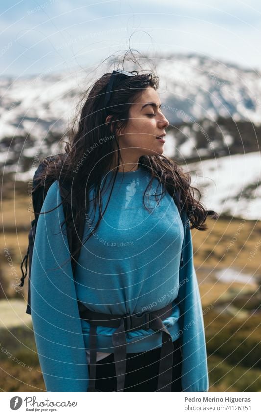 young woman portrait in the mountains nature female travel summer happy lifestyle beautiful person girl outdoor caucasian vacation landscape people adventure