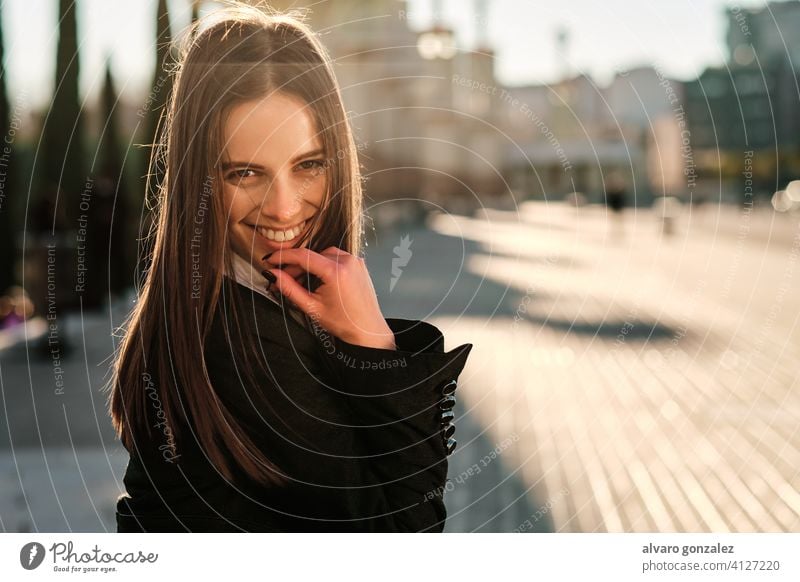 Portrait of young woman smiling outdoors. stylish urban street lifestyle city brunette sombrero day people one elegance looking clothing elegant smile caucasian