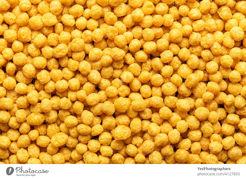 Breakfast cereals with honey, background, top view. Corn cereal balls, close-up above view abundance backdrop breakfast childhood confectionery copy space