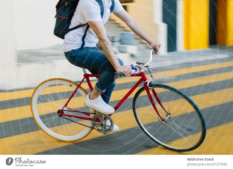Man riding a bike in the street bicycle fixie urban wheel fixed sport transportation gear lifestyle wall hipster ride pedal man biking chain action cyclist