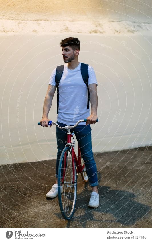 Man riding a bike at night bicycle fixie urban wheel fixed sport transportation gear lifestyle wall street hipster ride pedal man biking chain action cyclist