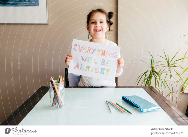 Schoolgirl demonstrating drawing with positive message everything will be alright support share show art inscription colorful demonstrate pencil kid creative