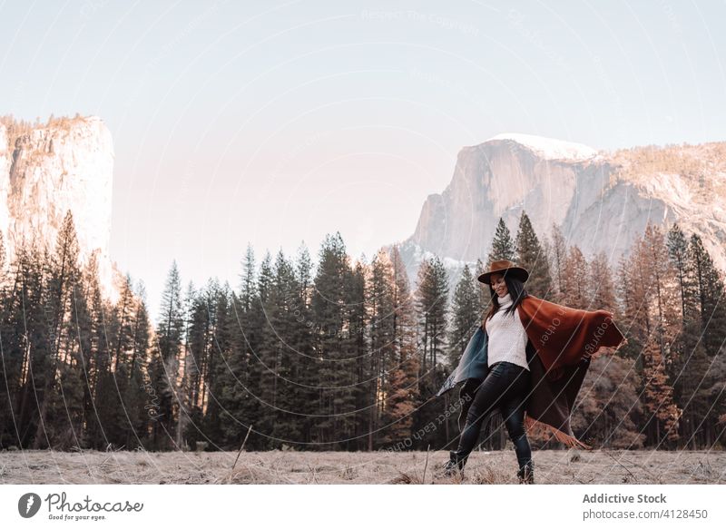 Happy traveler walking on mountain valley in spring day woman forest happy freedom yosemite park cliff rock national female style cheerful trendy joy landscape