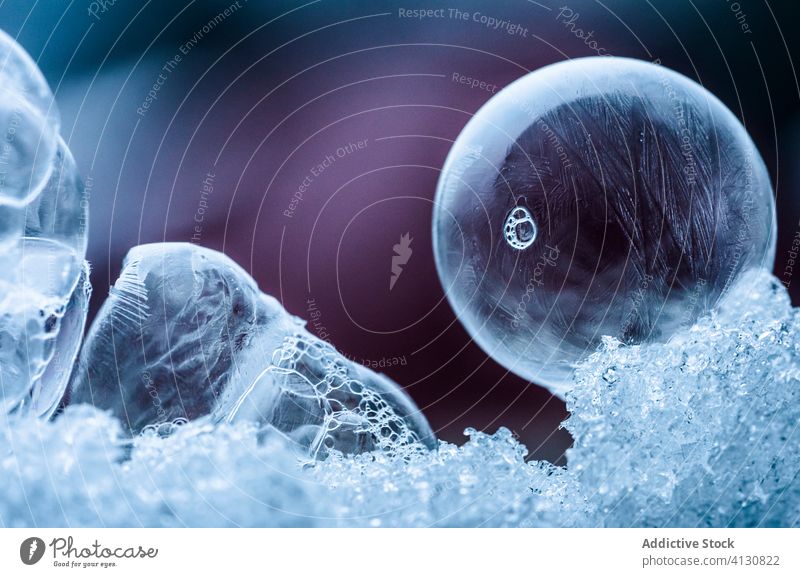 Abstract background with frozen bubbles ice abstract cold transparent soap frost form shape sphere fragile freeze circle fresh liquid purple translucent fluid