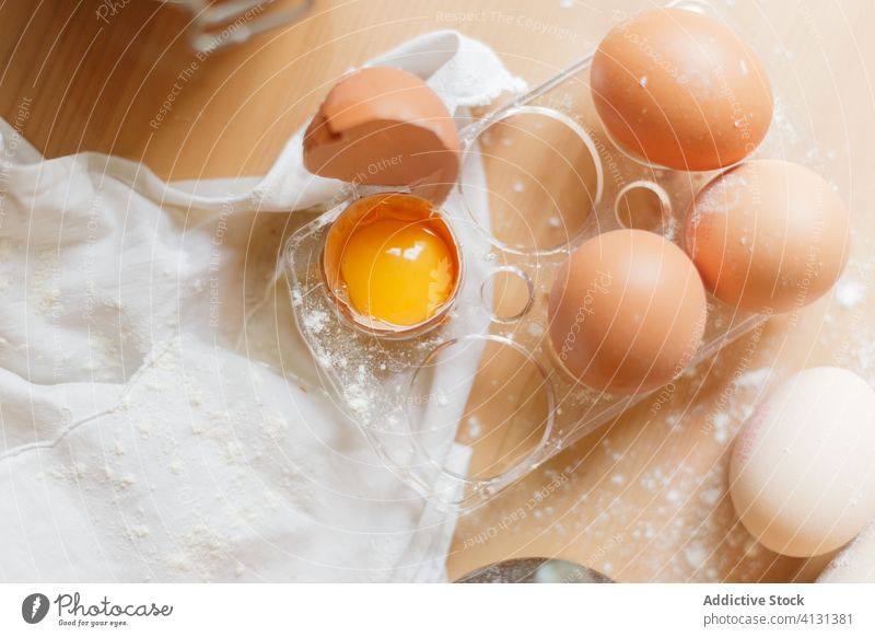 Eggs and flour on wooden table for cooking pasta egg cookery yolk raw towel dough prepare eggshell food gastronomy protein kitchen ingredient cuisine culinary