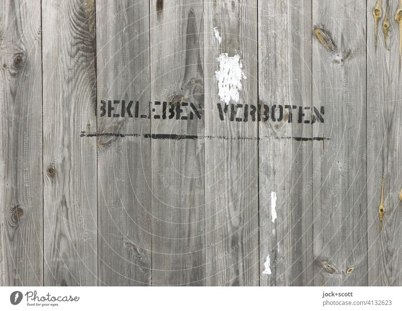 STICK ON FORBIDDEN Wooden wall Hoarding Wooden fence Inscription Bans Typography Stencil letters Vandalism Characters Wooden board Word Ravages of time