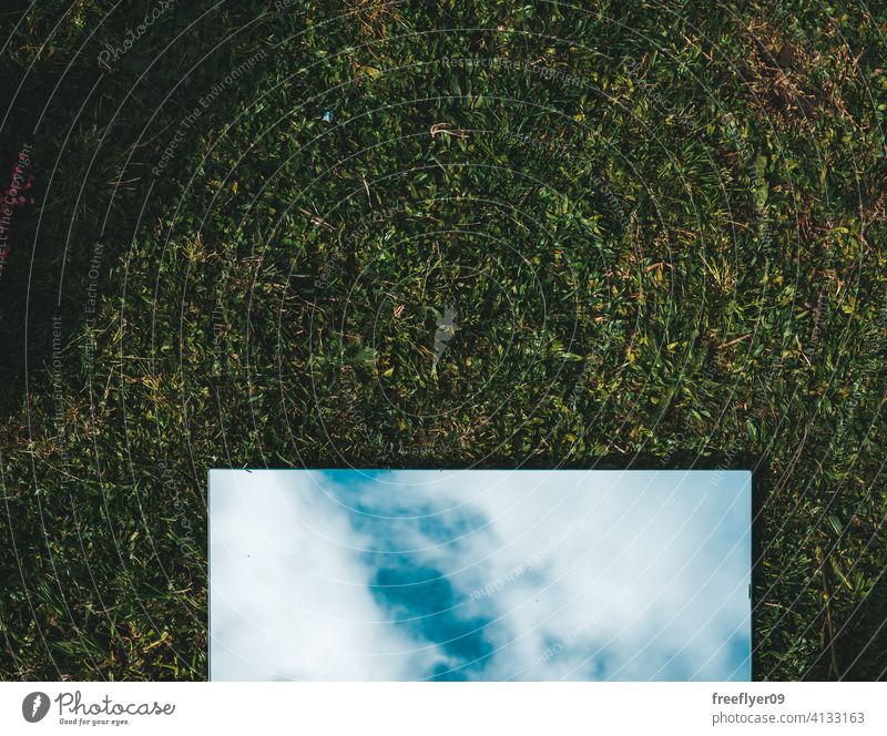 Amazing flat lay of a mirror on the grass background abstract sky mockup copy space rectangle clouds nature light natural no people nobody organic shape simple