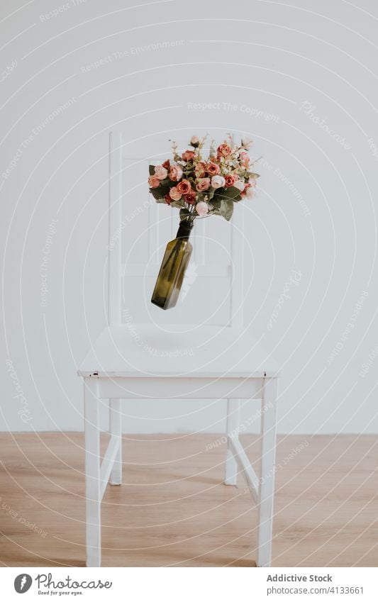Wedding bouquet on a chair wedding floating vase levitation decoration white event arrangement beautiful floral luxury romantic flower party beauty romance