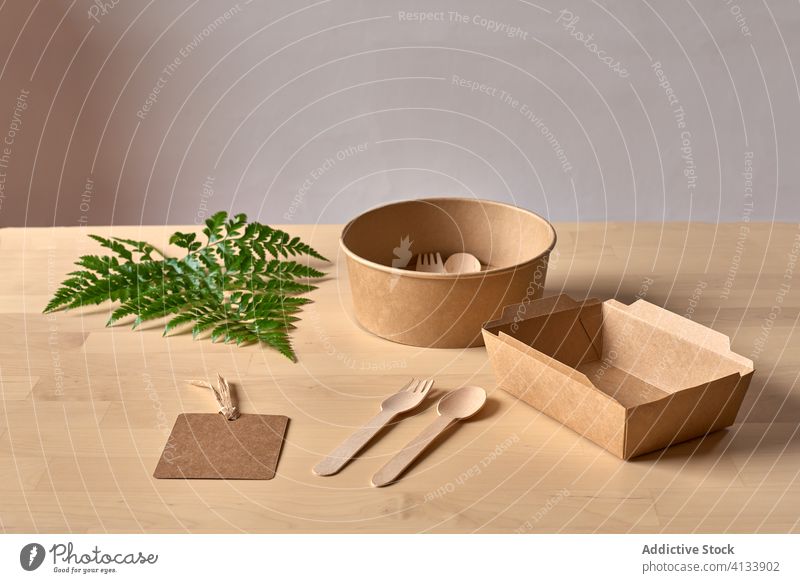 Cardboard box and wooden utensils package carton recycle disposable eco friendly ecology natural concept zero waste organic arrangement composition cardboard
