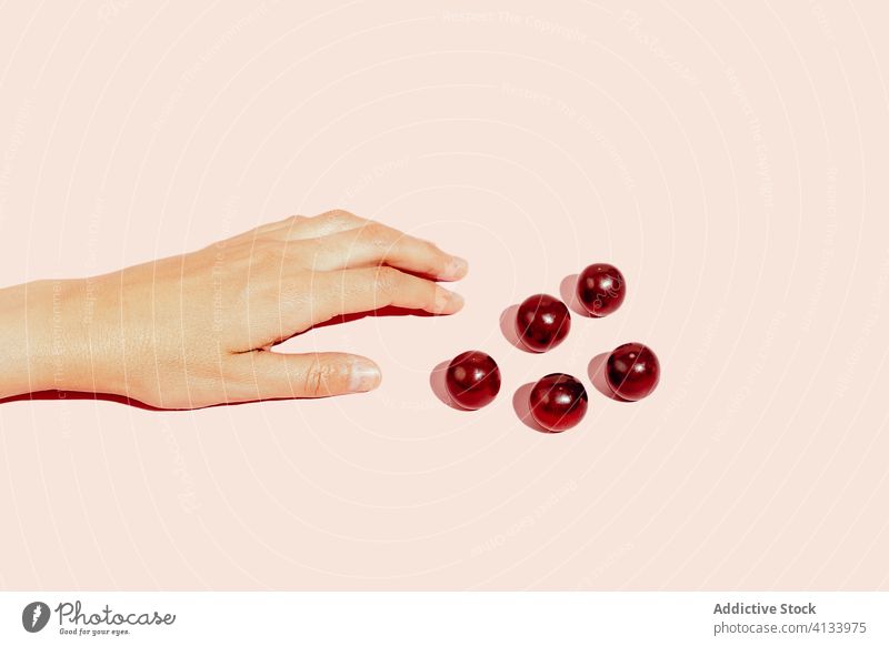 Crop person hand with grapes in studio fruit healthy food ripe vitamin delicious fresh tasty organic sweet natural nutrition diet ingredient vegetarian raw