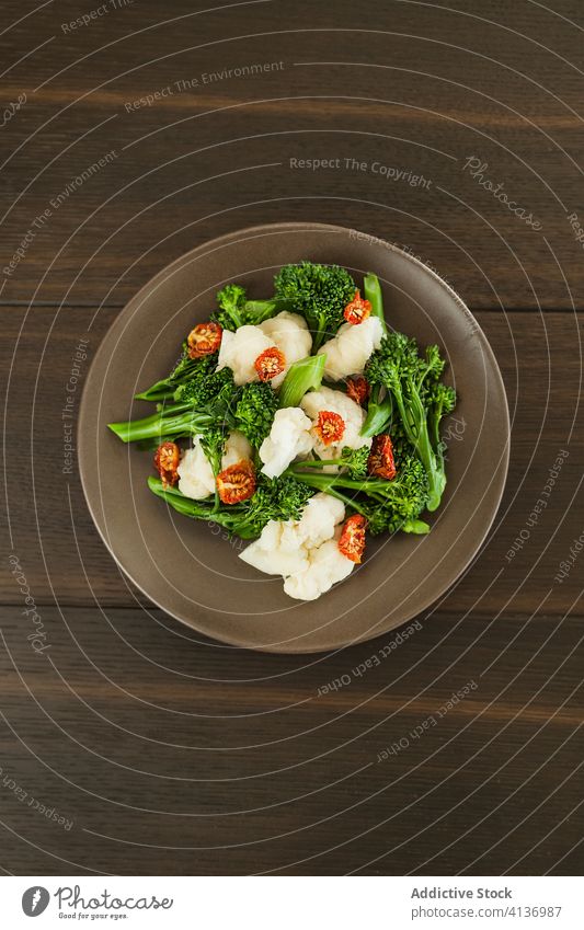 Bowl of broccolini with cheese and dried tomatoes salad organic meal dish cuisine food delicious vegetable composition nutrition vegetarian lunch dinner recipe