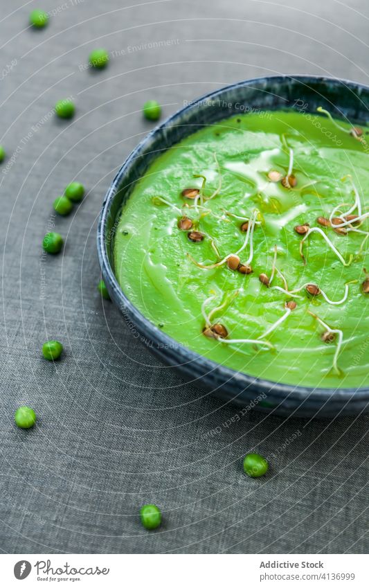 Green pea puree with green sprouts cuisine bowl organic nutrition fresh food snack dip gourmet healthy vegan delicious oil vegetarian natural ingredient diet