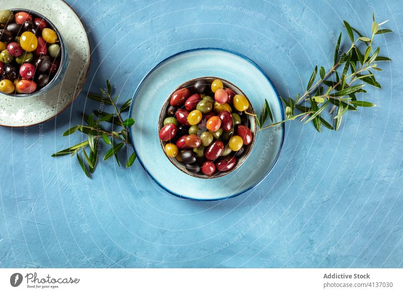 Olives. A variety of green, black and red olives, with leaves, shot from the top kalamata brown assortment overhead above antipasti view sorts types various