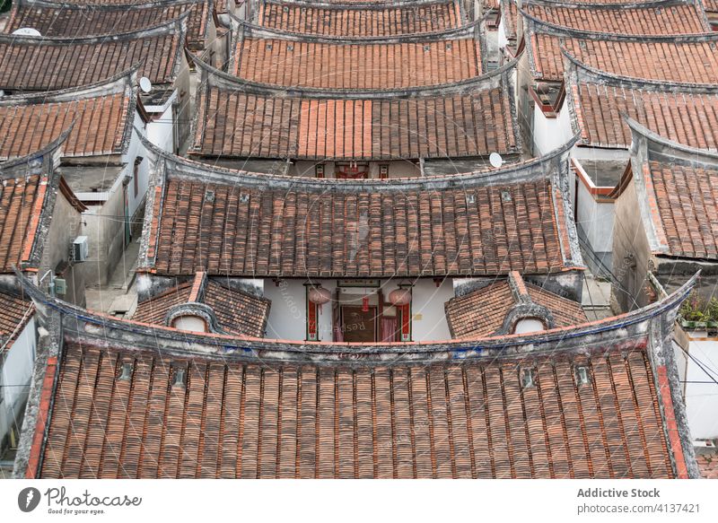 Shabby rooftops of residential houses in village shabby building curve oriental row tile aged daimei china tradition old architecture structure ancient historic