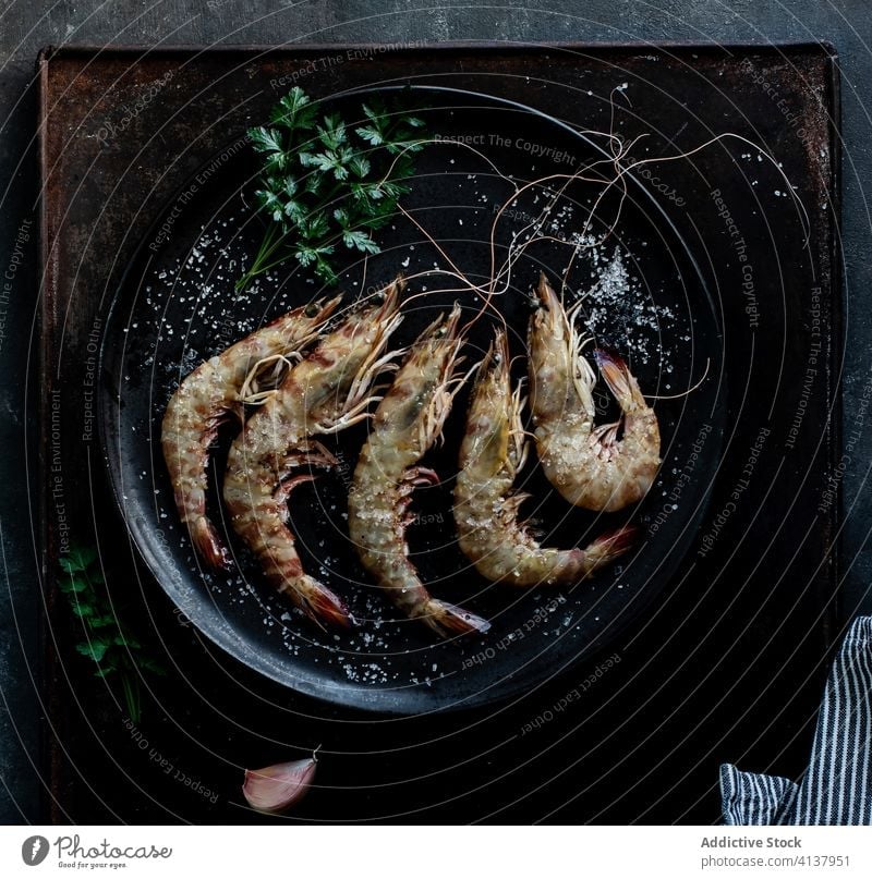 Prawns served in plate on table on dark background dark mood sea food plate seafood raw fish prawns cold culinary marine cooking appetizer delicious top fresh